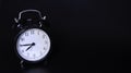 Close up image of old black vintage alarm clock. Seven`clock and forty-five minutes Royalty Free Stock Photo