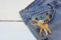 Pair of Old Jeans and House Keys Royalty Free Stock Photo