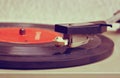 Close up image of old record player, image is retro filtered . selective focus