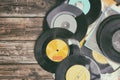 Close up image of old records over wooden table , image is retro filtered . Royalty Free Stock Photo