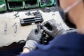 Close-up image of a person in protective gear working on a piece of metal