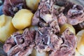 Boiled lamb meat and whole potatoes close up