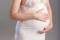 Close-up image of pregnant woman touching her belly with hands. Copy space Royalty Free Stock Photo