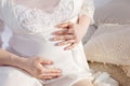 Close-up Image of pregnant woman touching her belly with hands Royalty Free Stock Photo