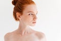 Close up image of Pretty naked ginger woman looking away