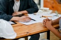 Close-up image of a professional Asian male engineer or architect is having a meeting with a client Royalty Free Stock Photo