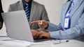 Close-up image of a professional businesswoman pointing her finger at a laptop screen Royalty Free Stock Photo