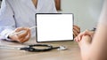 Close-up image, A professional female doctor showing something on tablet screen Royalty Free Stock Photo