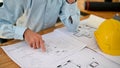 Close-up image of a professional male engineer or contractor man checking a blueprint Royalty Free Stock Photo