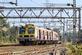 Close up image of Pune to Lonavala local EMU train with Siemens rake is speeding