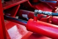 Close up red pneumatic cylinder in idustrial plant Royalty Free Stock Photo