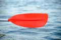 Close up Image of Red Kayak Paddle under Water Royalty Free Stock Photo