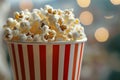 Close up image of a red and white striped popcorn cup