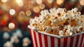 Close up image of a red and white striped popcorn cup