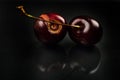 Close up of image of rotten red cherries fruit on reflective black background. Selective focus. Lights and shadows Royalty Free Stock Photo