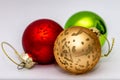 Different coloured bauble Christmas decorations close up