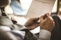 Close up image Senior businessman sign in papers. Focus on hand.