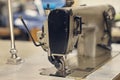 Close-up image of a sewing machine at the sewing workshop. Royalty Free Stock Photo