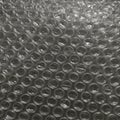 Close-up image of a sheet of bubble wrap, featuring a regular pattern of small, Royalty Free Stock Photo