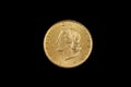 An old Italian lira coin shot against a black background Royalty Free Stock Photo