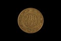 An old Italian lira coin shot against a black background Royalty Free Stock Photo