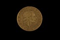 An old Italian lira coin shot against a black background Royalty Free Stock Photo