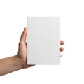 A plain white blank book or notebook held upright by a human hand against white background Royalty Free Stock Photo