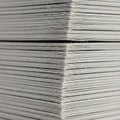 Close up view of a stack of white paper sheets arranged in parallel lines Royalty Free Stock Photo