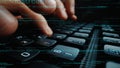 Close-Up of Hands Typing on a Keyboard with Code Overlay, Highlighting the Connection Between Programming and Technology Royalty Free Stock Photo
