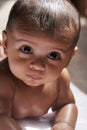 A close up image of a Small Male Baby with Big eyes looking Royalty Free Stock Photo