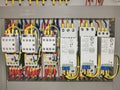 Close up image soft starter and contactor wiring in electrical cabinet. Selective focus.