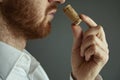 Close up image of sommelier examining smell of wine cork