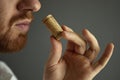 Close up image of sommelier examining smell of wine cork