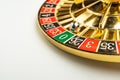 Close-up image of a spinning roulette wheel with numbers 1-36, odd and even, single zero in green Blurred background Royalty Free Stock Photo