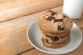 Close up image of Stack of chocolate cookies and cup of milk Royalty Free Stock Photo