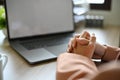 Close-up, Stressed Asian businesswoman clasped her hands on the table