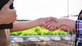 Close-up image of a successful farm owner shaking hand with a farmer or supplier, dealing business Royalty Free Stock Photo