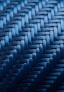 A close-up image of a symmetric woven pattern made from blue plastic or synthetic Royalty Free Stock Photo