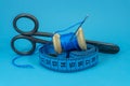 Thread, scissors tape measure and sewing needle Royalty Free Stock Photo