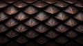 A close-up image of a textured surface with a repeating pattern of dark brown and orange shapes. Royalty Free Stock Photo
