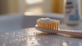 Close-up image of toothbrush with toothpaste in sunlit bathroom setting Royalty Free Stock Photo