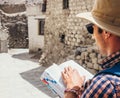 Close up image tourist with guide book on asian street Royalty Free Stock Photo