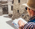 Close up image tourist with guide book on asian street