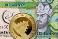 1 Manat from Turkmenistan with a Chinese gold coin Royalty Free Stock Photo