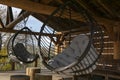 close up image of two big rotang round hanging chairs with grey pillow on outdoor backyard Royalty Free Stock Photo