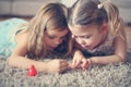 Close up image two little girls doing nails.