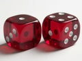 Two red dice rolling on a white surface Royalty Free Stock Photo