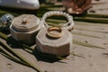 two rings on a pedestal near other jewelry items and pearls Royalty Free Stock Photo