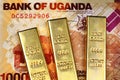 Ugandan 1000 shilling bank note with three gold bars