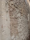 A close-up image of an unfinished concrete wall that has not been plastered